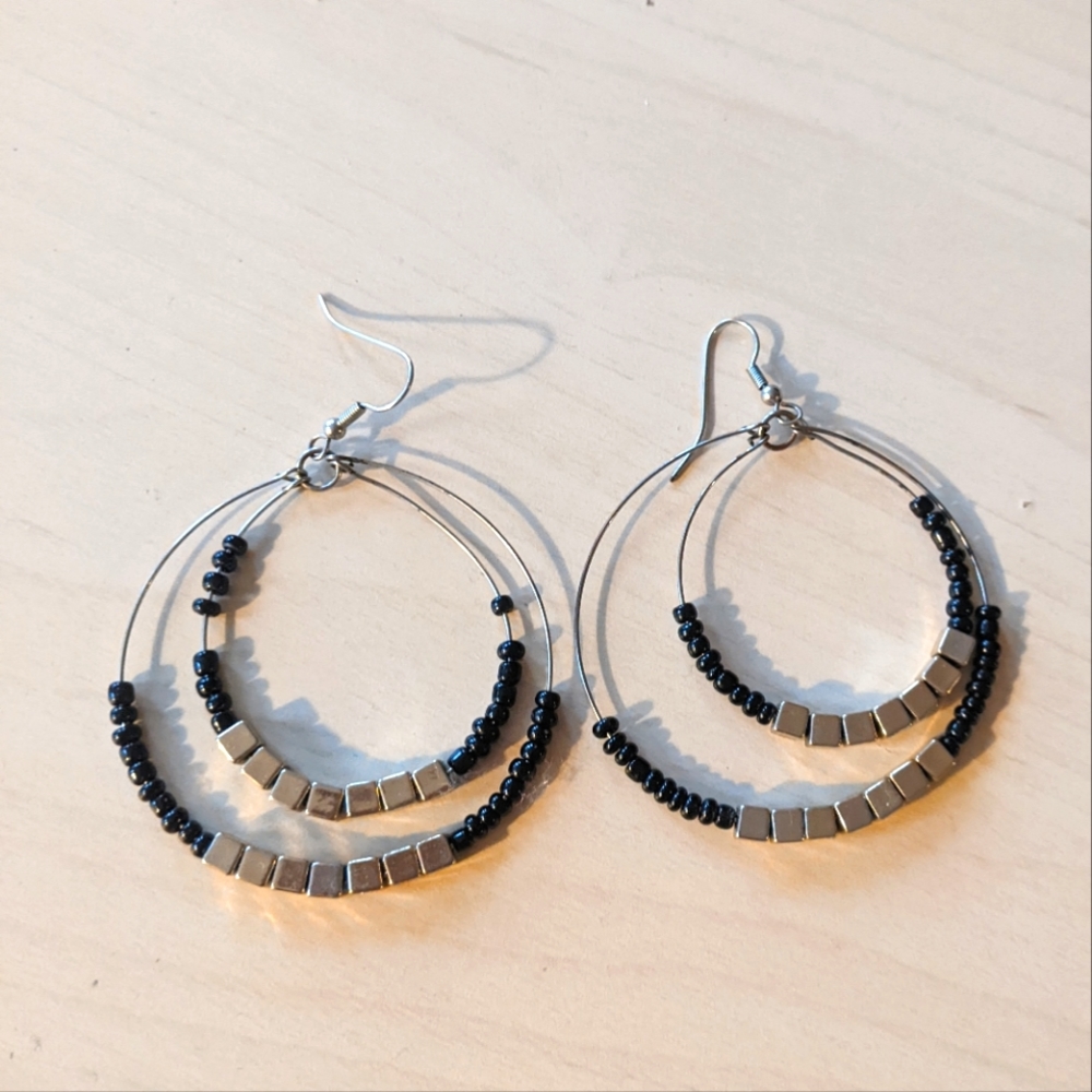 $15/3 Dangle black and gold hoop earrings